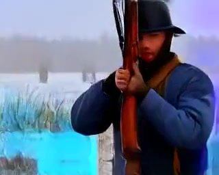 Rifles at Dawn music video poster — minuteman on a frozen field at dawn
