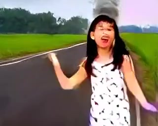 Napalm Morning music video poster — girl running on a Vietnamese road